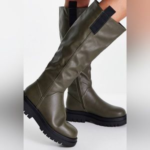 Chunky green knee high boots. Only tried on a couple of times inside the house.